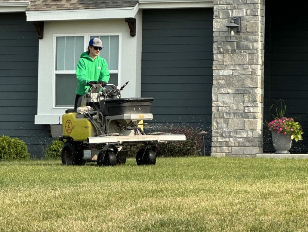 A person in a lawn mowner machine