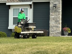 A person in a lawn mowner machine
