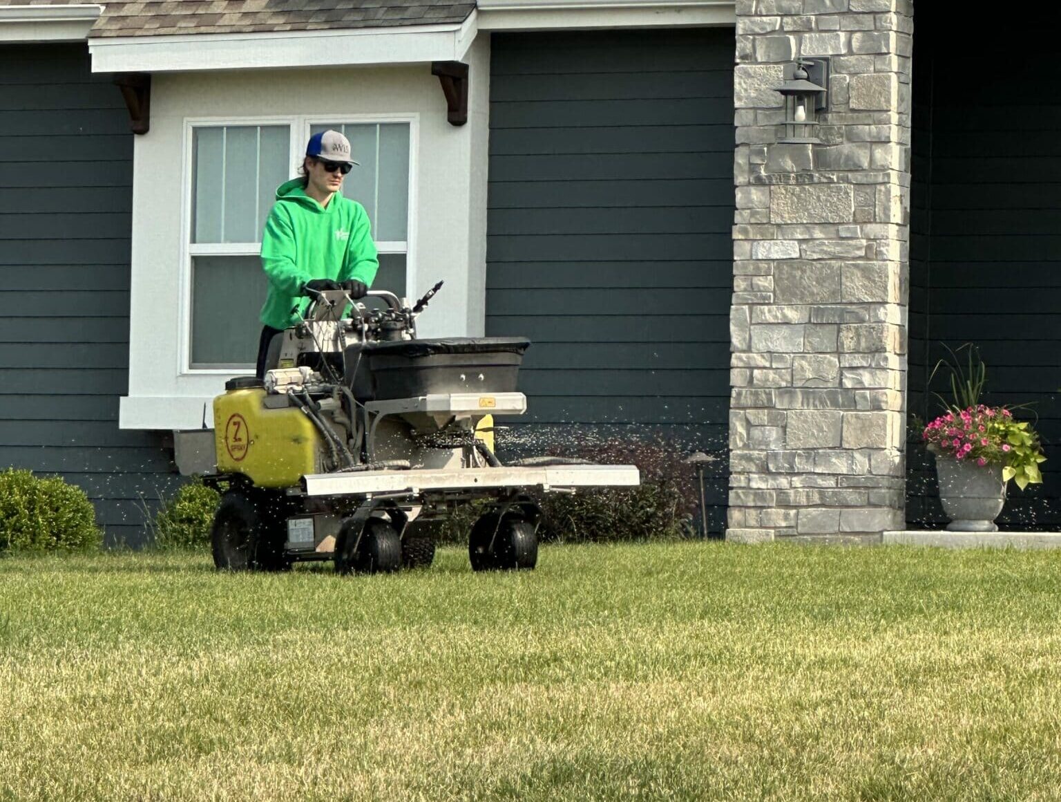 A person in a lawn mowner machine